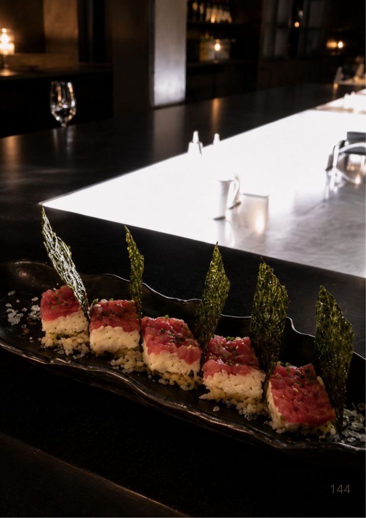 The chef's counter at Honto in Fortitude Valley, Brisbane, with courses plated along the pass