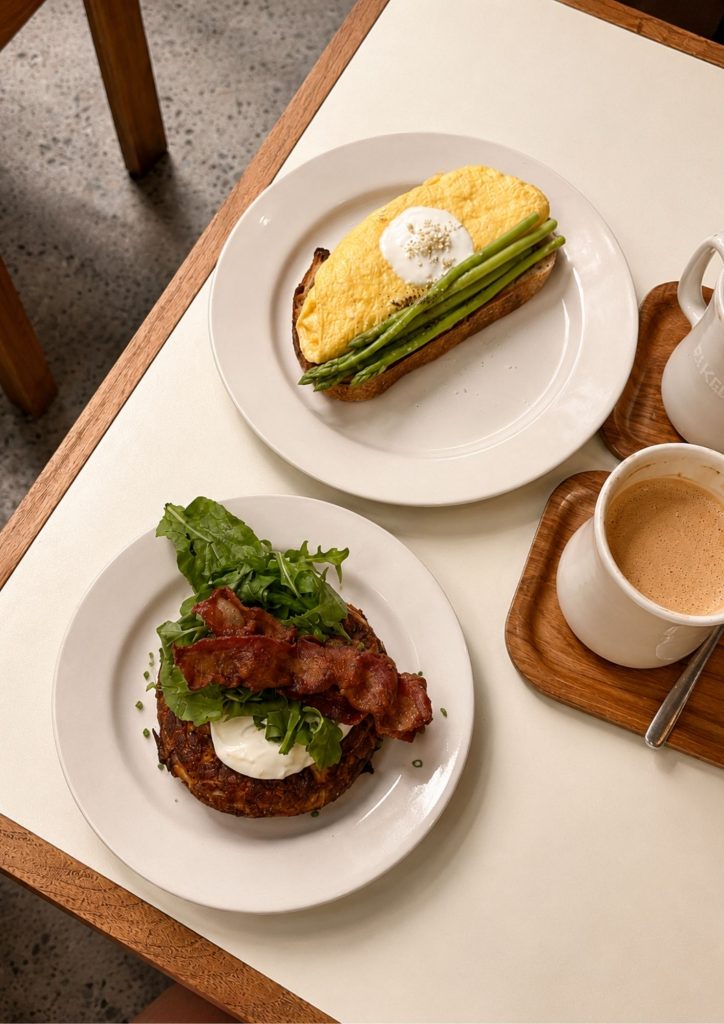 Breakfast at BAKED. in Canggu, Bali: asparagus on sourdough and bacon with poached egg on rosti