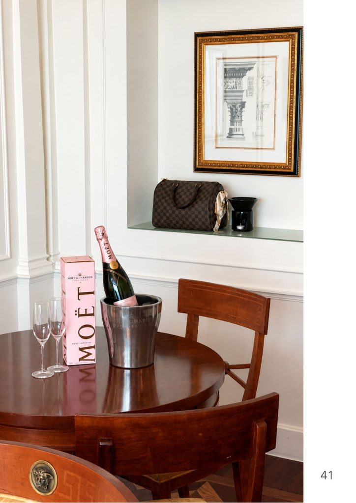 A champagne bucket on a timber table in a Gold Coast dining room