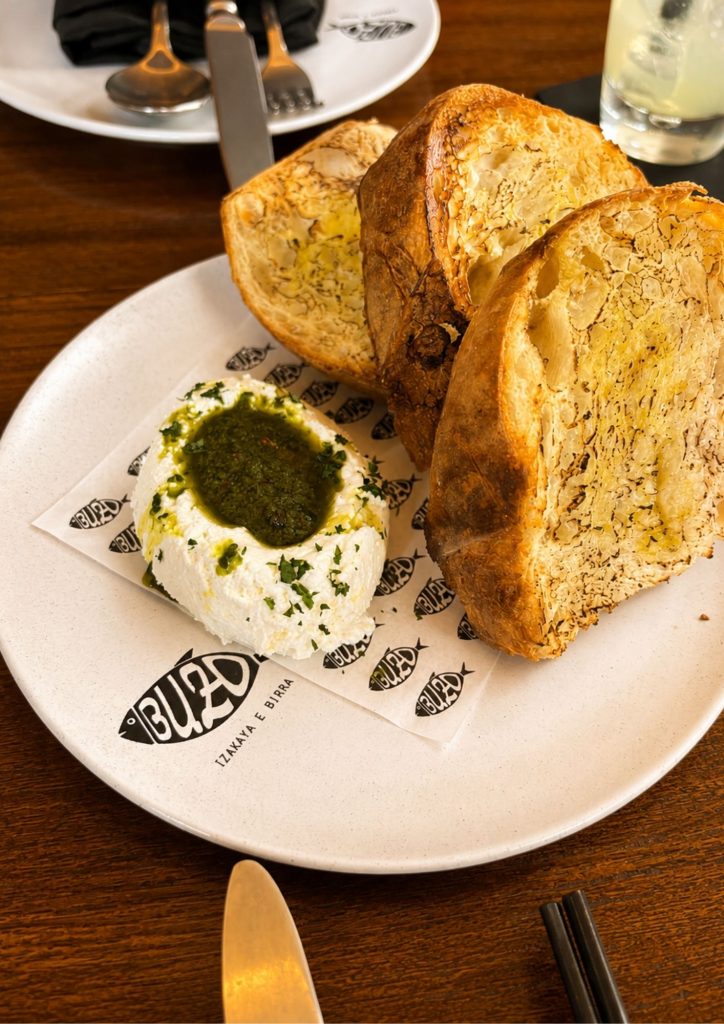 Burrata with toasted sourdough at Buzo, the Japanese-Italian restaurant in Seminyak, Bali