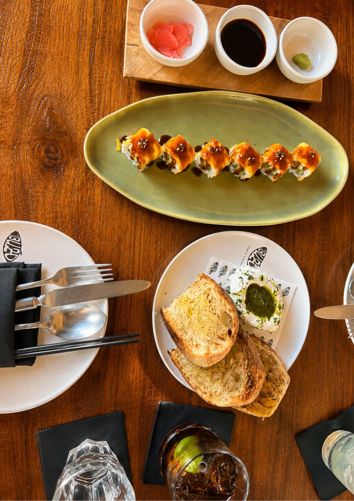 Sushi, sourdough and dipping sauces at Buzo, the Japanese-Italian restaurant on Jalan Kayu Aya in Seminyak, Bali