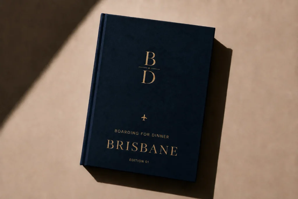 Brisbane Food Guide digital edition cover from Boarding for Dinner, a navy linen book with gold foil lettering