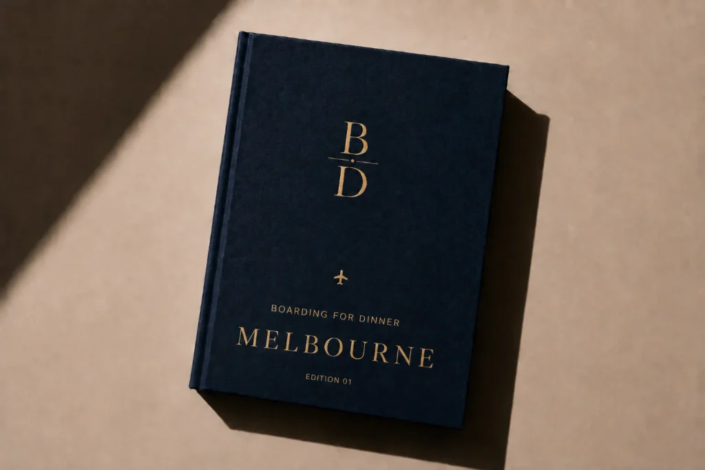 Melbourne Food Guide digital edition cover from Boarding for Dinner, a navy book with gold foil lettering