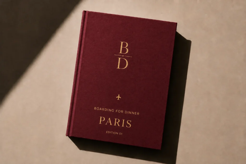 Paris Food Guide digital edition cover from Boarding for Dinner, a burgundy book with gold foil lettering