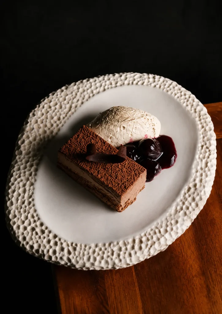 A chocolate dessert with berry compote at a Bali restaurant